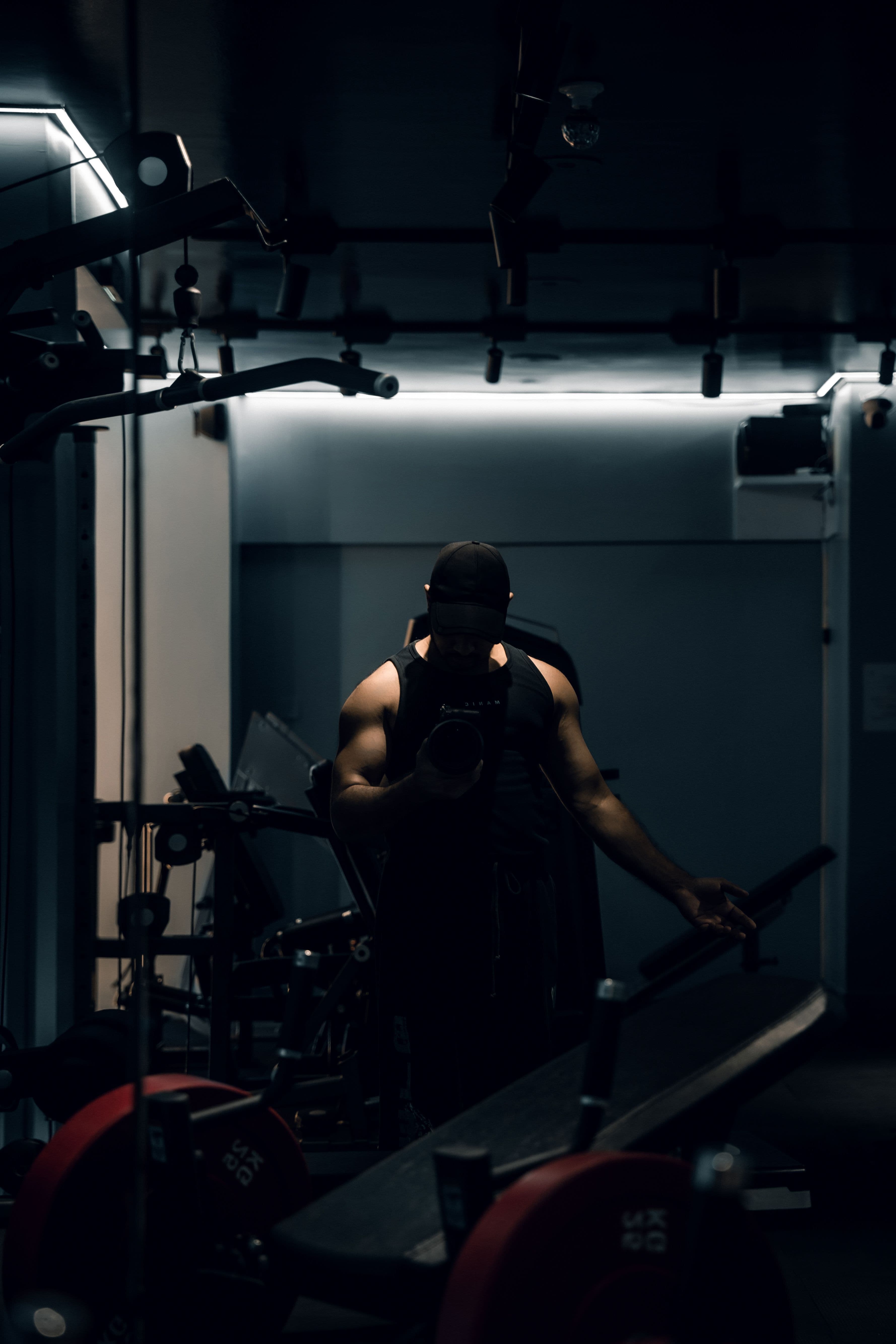 Athlete training in a dark modern gym